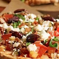 Large Greek Pizza · Fresh garlic, olive oil, tomatoes, onions, black olives and feta cheese.