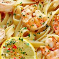 Shrimp Scampi · Served with our own special white wine sauce , shrimps on a bed of pasta.