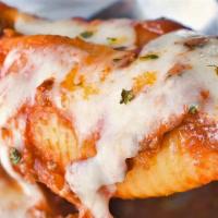 Stuffed Shells · Shells stuffed with ricotta cheese, smothered in tomato sauce.