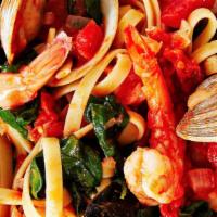 Frutti Di Mare · A mix of mussels, shrimp, calamari and sauteed with marinara sauce on a bed of pasta.