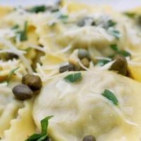 Spinach Ravioli · Our delicious spinach ravioli served with cream sauce.