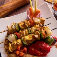 Chicken Kabob · A skewer of marinated chicken breast, flame grilled, garlic spread, lettuce, and pickles. Se...