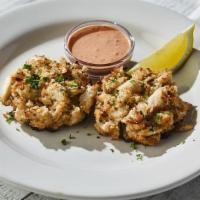 Maryland-Style Crab Cakes · House-made lump crab cakes with red remoulade sauce (620 cal)