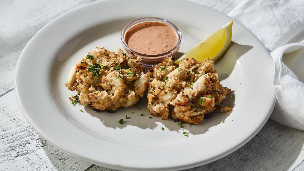 Maryland-Style Crab Cakes · House-made lump crab cakes with red remoulade sauce (620 cal)