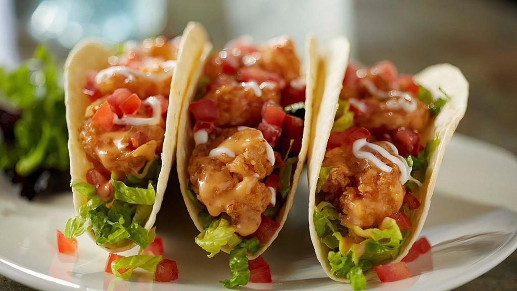 Bang Bang Shrimp Tacos · Three warm tortillas, our signature Bang Bang Shrimp, greens, tomatoes and sour cream (1570 cal)