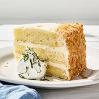 Key Lime Cake · A generous slice of vanilla citrus cake layered with sweet-tart key lime frosting, lightly d...