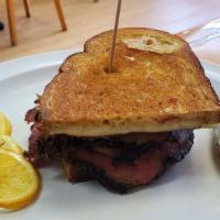 Pastrami Reuben Sandwich · Made with melted Swiss cheese, sauerkraut, and Russian dressing on grilled rye bread.