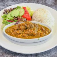 Curry Goat · Tender Goat meat seasoned with our authentic blended curry powder. Served with Rice and Peas...