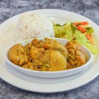Curry Chicken · Seasoned with our authentic blended curry powder. Served with Rice and Peas or White Rice an...