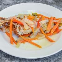 Escovitch Whole Snapper · Whole Snapper Fish seasoned , fried and sautéed in a spicy vinegar-based sauce made with jul...