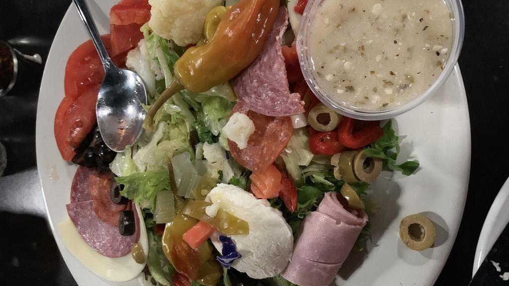 Ale Special Salad · Blended lettuce, spring mix, tomatoes, red onion, cucumber, ham, salami, provolone, pepperoni, fresh mozzarella roasted red peppers, pepperoncini, shredded mozzarella, and black olives.