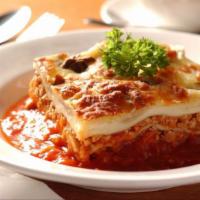 Ale Homemade Lasagna · We start off with lasagna shells and fill each layer with ricotta cheese, and add Romano, fr...