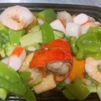 Seafood Delight · Lobster, shrimps, scallops and crab meat sauteed with mixed vegetables in special white sauce.