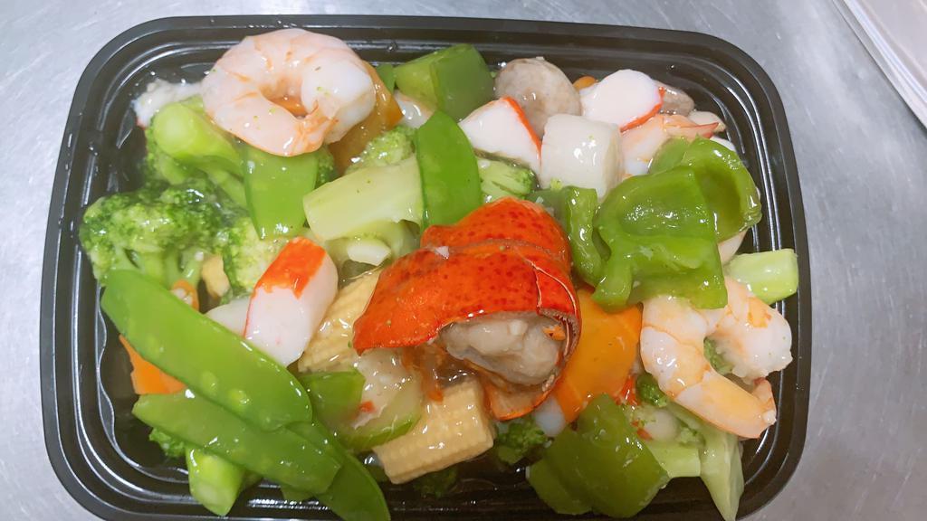 Seafood Delight · Lobster, shrimps, scallops and crab meat sauteed with mixed vegetables in special white sauce.