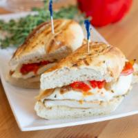 Grilled Chicken Sandwich · 8 oz all-natural chicken breast, fresh mozzarella, caramelized onions, red bell peppers.