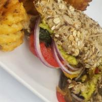 Veggie Sandwich · Portobello mushrooms, red onions, avocado mash, red bell peppers, grilled zucchinis and eggp...