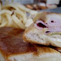 Cuban Sandwich · Our Boar's Head Ham, Pork, Sliced Pickles, Mayonnaise, Spicy Mustard and Melted Swiss Cheese...