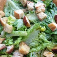 Caesar Salad · Romaine Lettuce, Parmesan Cheese and Croutons served with Caesar Dressing.