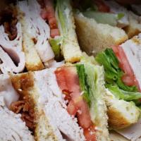 Turkey Club · Our delicious Boar's Head Turkey served on Toasted White Bread with Lettuce, Tomato, Bacon a...