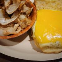 American Burger · Burger with American Cheese topped with a Fried Egg.