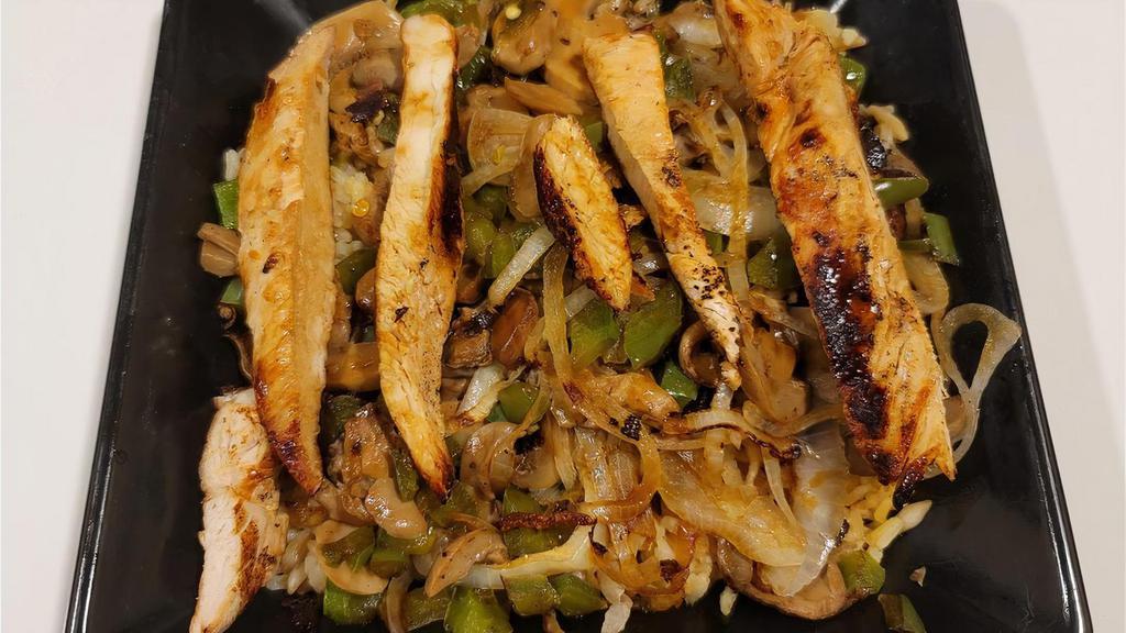 Grilled Chicken Teriyaki · Grilled Chicken over a bed of Rice Pilaf, Grilled Onions, Green Peppers, Mushrooms, and Teriyaki Sauce.