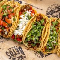 4 Tacos · Street tacos include cilantro and dice onions