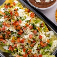 Chicken Enchiladas · 5 chicken and green salsa enchiladas topped with lettuce, queso fresco, sour cream, sliced a...