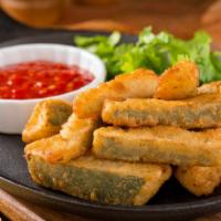 Zucchini Sticks · Deep-fried lightly battered zucchini sticks, served with your choice of bistro or ranch sauce.