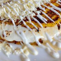 Cachapa Mano Cheese · Gluten free sweet corn Venezuelan pancake folded with fresh mano cheese. Topped with nata an...