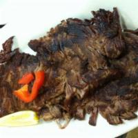 Chicken Vaca Frita · Shredded chicken grilled topped with salted onions.