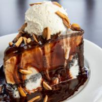 Mud Pie · Oreo cookies crust, chocolate chip, and coffee ice cream, topped with hot fudge, freshly whi...