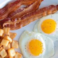 All-Star Breakfast · Two freshly-cracked eggs over easy with crispy bacon, breakfast potatoes, and a buttermilk b...