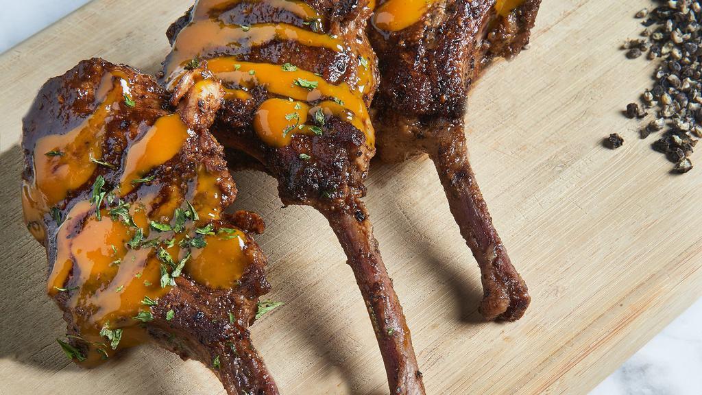Lamb Chops & Sides (2) · Three lollipop lamb chops, glazed in signature sauce. With your choice of two sides.