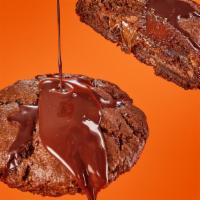 Triple Choco... En La Cama Somos 3 · Special chocolate dough. Filled with Nutella. Topped with a ganache drip volcano. For chocol...