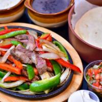 Steak Fajitas (Enough For 2) · 8oz sirloin steak with sauce onions, green and red peppers, rice and beans, guacamole, sour ...