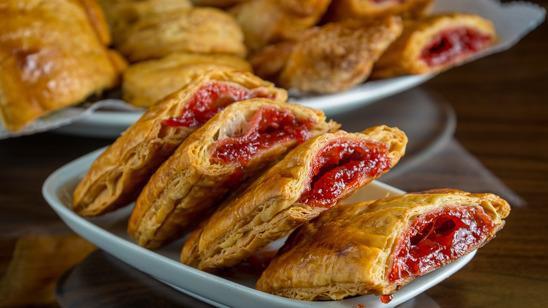 Pastelitos · Filled in soft and flaky sweet glazed original recipe dough.