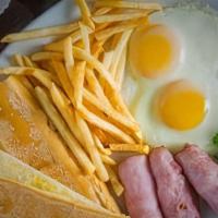 Dos Huevos, Jamon O Tocino & Papas Fritas · Two eggs any style, ham or bacon, and French fries.
