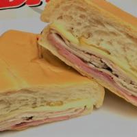 Cuban Sandwich · Ham, pork, Swiss cheese, and pickles optional with mayonnaise and mustard.