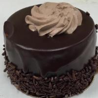 Mousse De Chocolate
 · Rich vanilla panetella, chocolate whipped cream filling, covered with melted chocolate creat...