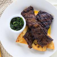 Skirt Steak Chimichurri · Tender grilled skirt steak marinated and grilled to
 perfection, topped with homemade chimic...