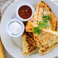Jacaranda Quesadilla · Grilled with your choice of chicken or seafood, melted cheddar, onions and a hint of cilantr...