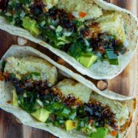 De Alcachofa Taco · Breaded artichoke, guacamole, and chimichurri breaded Nikkei.