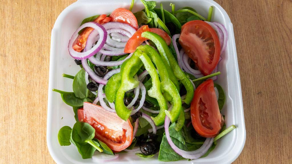 Spinach Salad · Fresh spinach, tomatoes, onions, green peppers, black and green olives, mozzarella cheese, feta cheese with blue cheese dressing.
