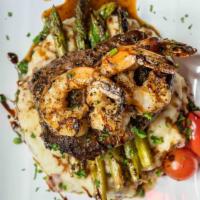 Surf & Turf · 7oz filet mignon and 3 grilled shrimp with grilled asparagus, red skin mashed potato and a r...