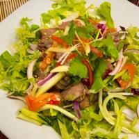 Ss3 Yum Nuer / Beef Salad · Grilled beef strips mixed with fresh Thai chili, cucumber, tomatoes,  onion,cilantro and dri...