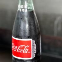 Coca-Cola · Coca-Cola of Mexico
16.9 oz bottle
Made with pure cane sugar  
No artificial flavors or pres...