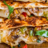 Philly Cheesesteak Quesadilla · steak, onions, peppers and shredded cheese stuffed into a 14