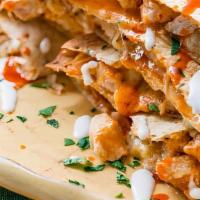 Buffalo Chicken Quesadilla · Seasoned grilled chicken, buffalo wings sauce, ranch dressing and cheese all mixed up togeth...