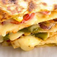Veggie Quesadilla · Mushrooms, onions, peppers, diced tomatoes and shredded cheeses stuffed inside of a 14