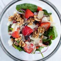 Strawberry Walnut Salad · Baby spinach, red onion, tomato, walnut, feta cheese, strawberry, cranberry, and raspberry d...